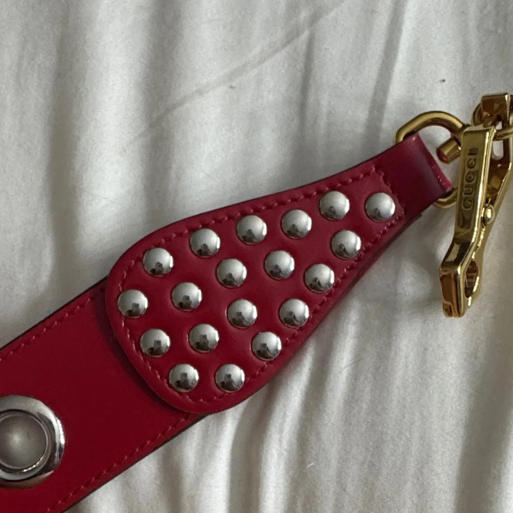 Gucci Red Leather Eyelet Strap with Gold Clasp